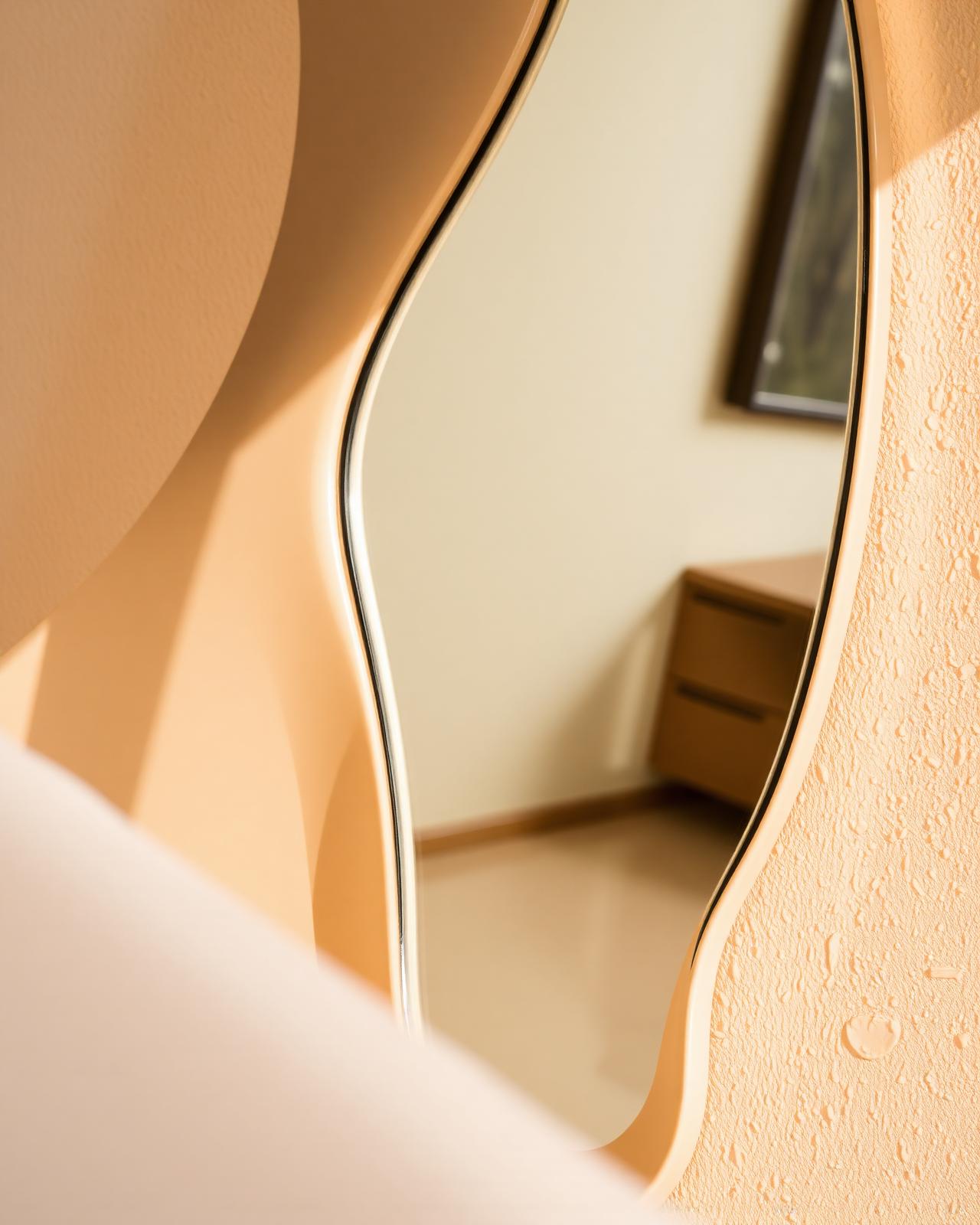 A sculptural wavy mirror in the studio